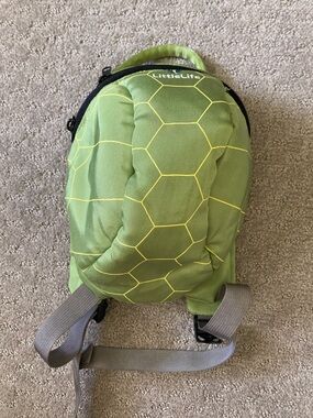 Little Life green turtle toddler backpack.